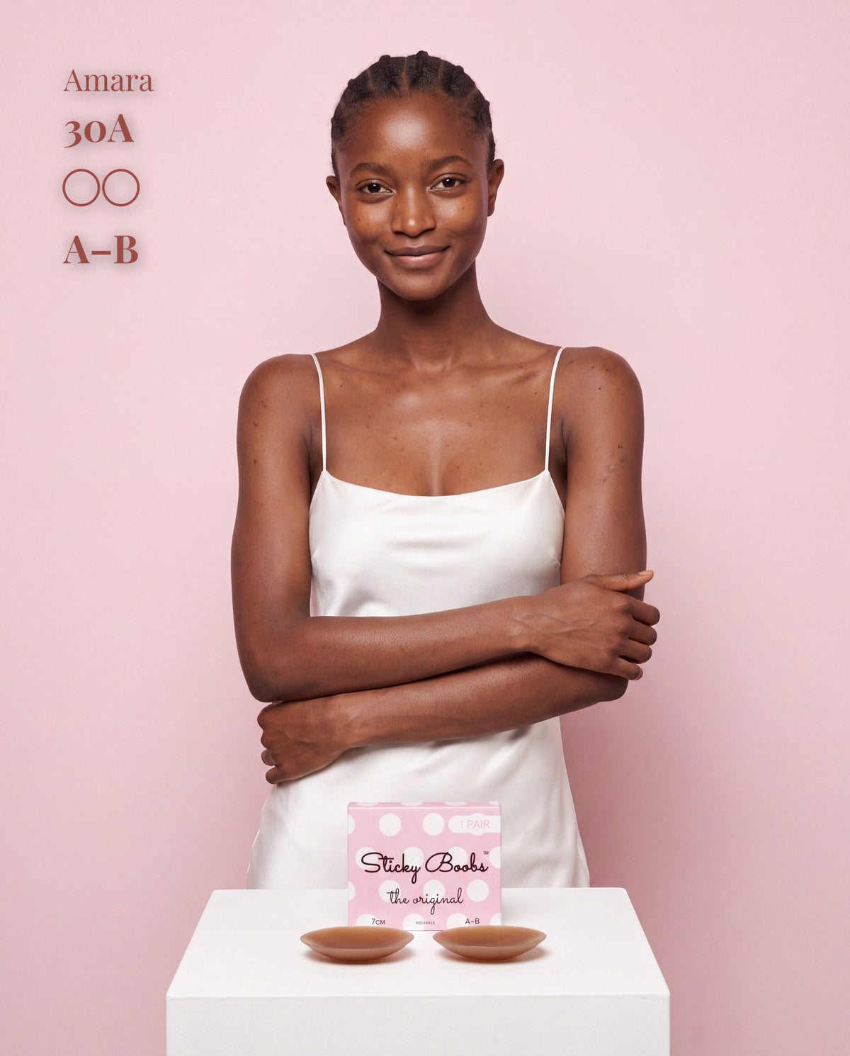 The Original Sticky Boobs, Dark shade, size A-B (7cm) — model with adhesive nipple covers and box 