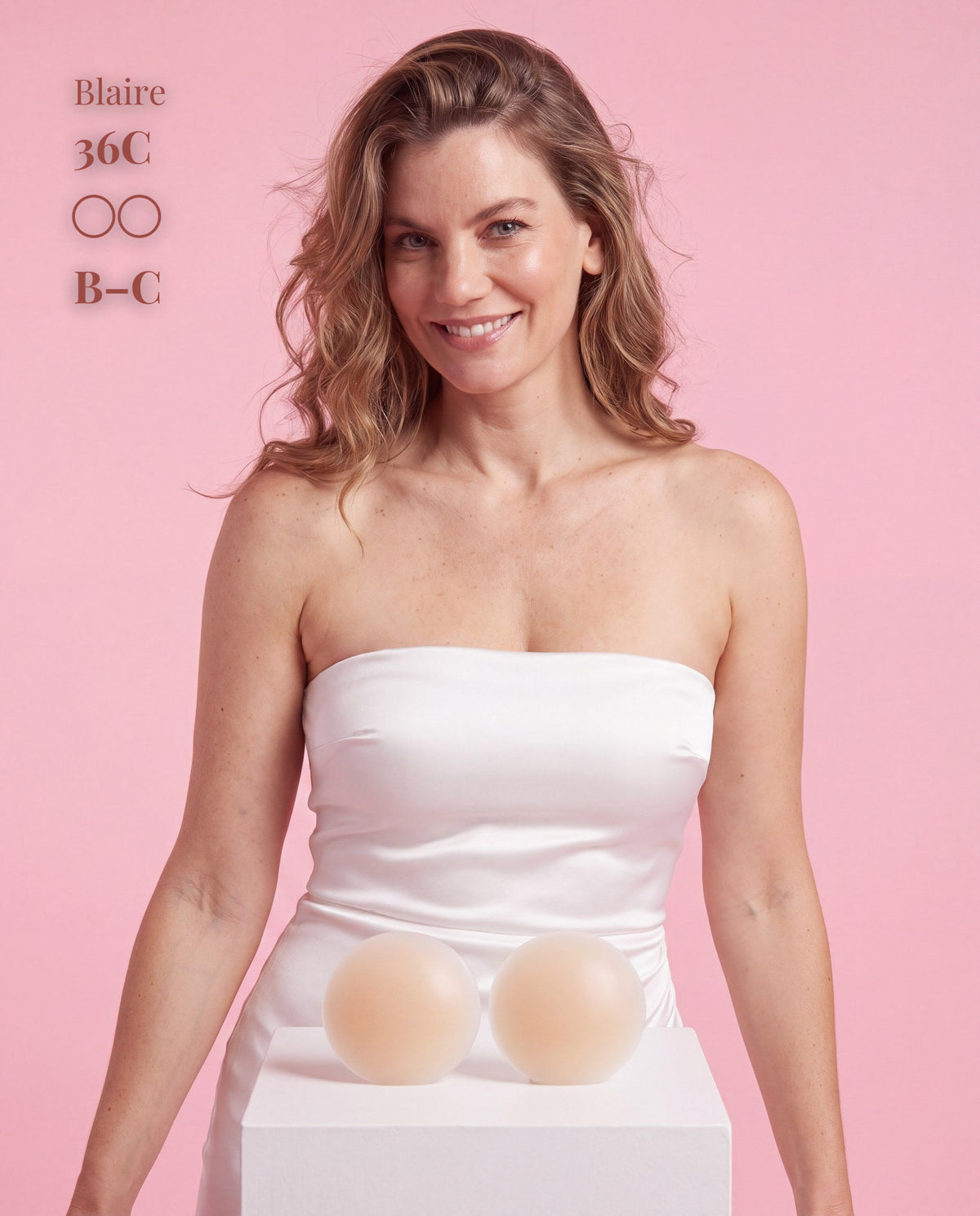 The Original Sticky Boobs, Light shade, size B-C (8cm) — model with adhesive nipple covers and box 