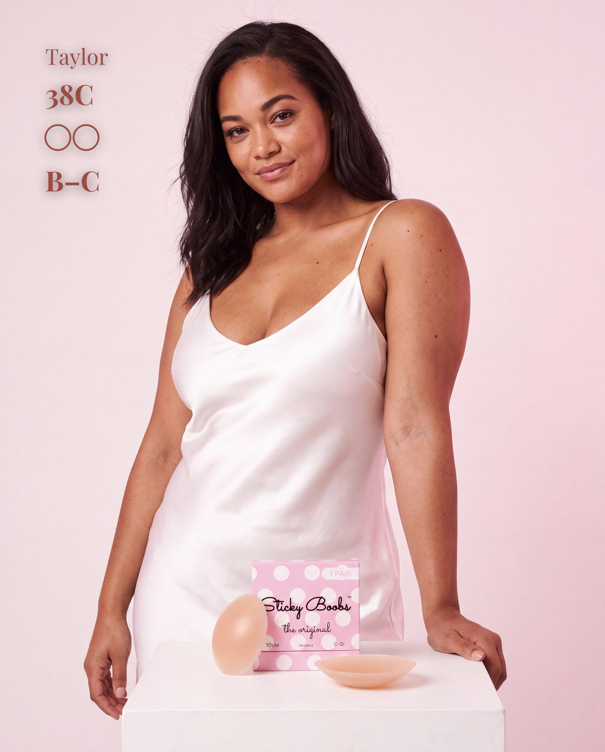 The Original Sticky Boobs, Tan shade, size B-C (8cm) — model with adhesive nipple covers and box 